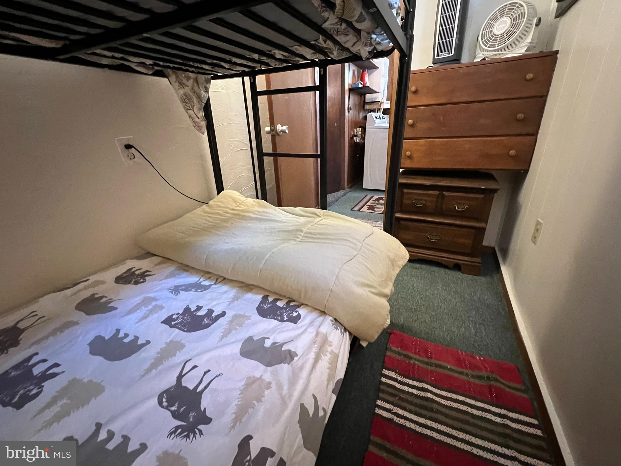 193 Gravelly Run Road McHenry, MD 21541 - Photo 35 of 57 a bed sitting in a bedroom next to a window