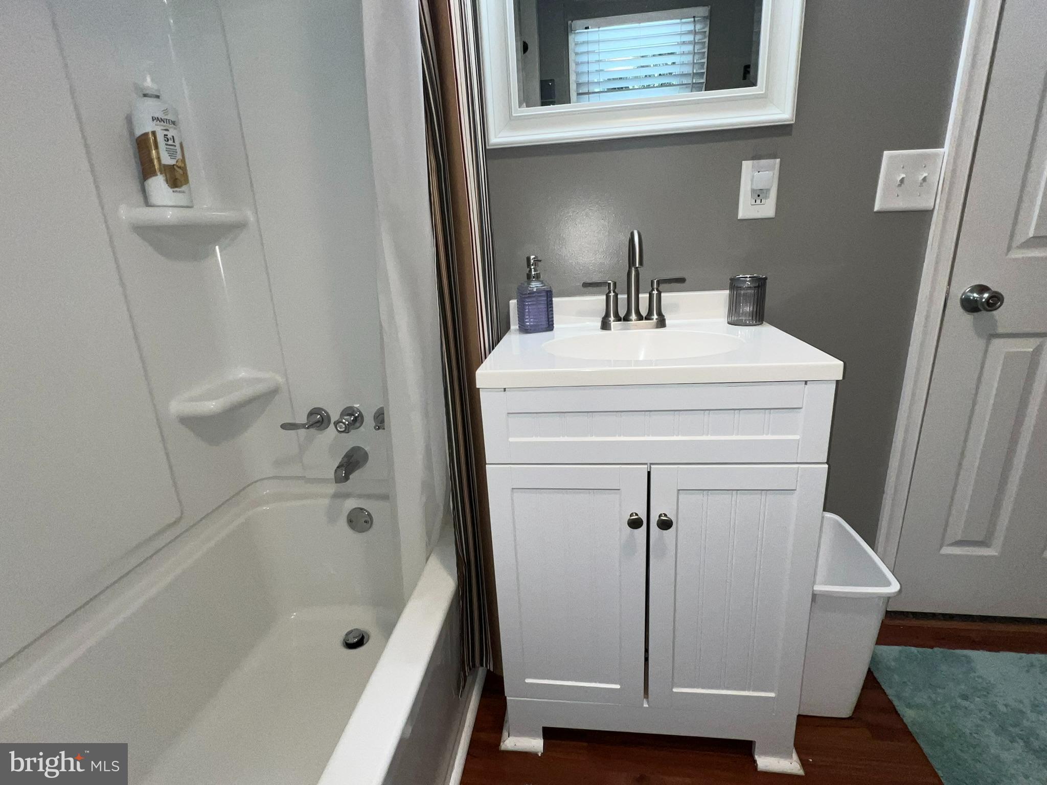 193 Gravelly Run Road McHenry, MD 21541 - Photo 37 of 57 a bathroom with a sink a mirror and a bathtub