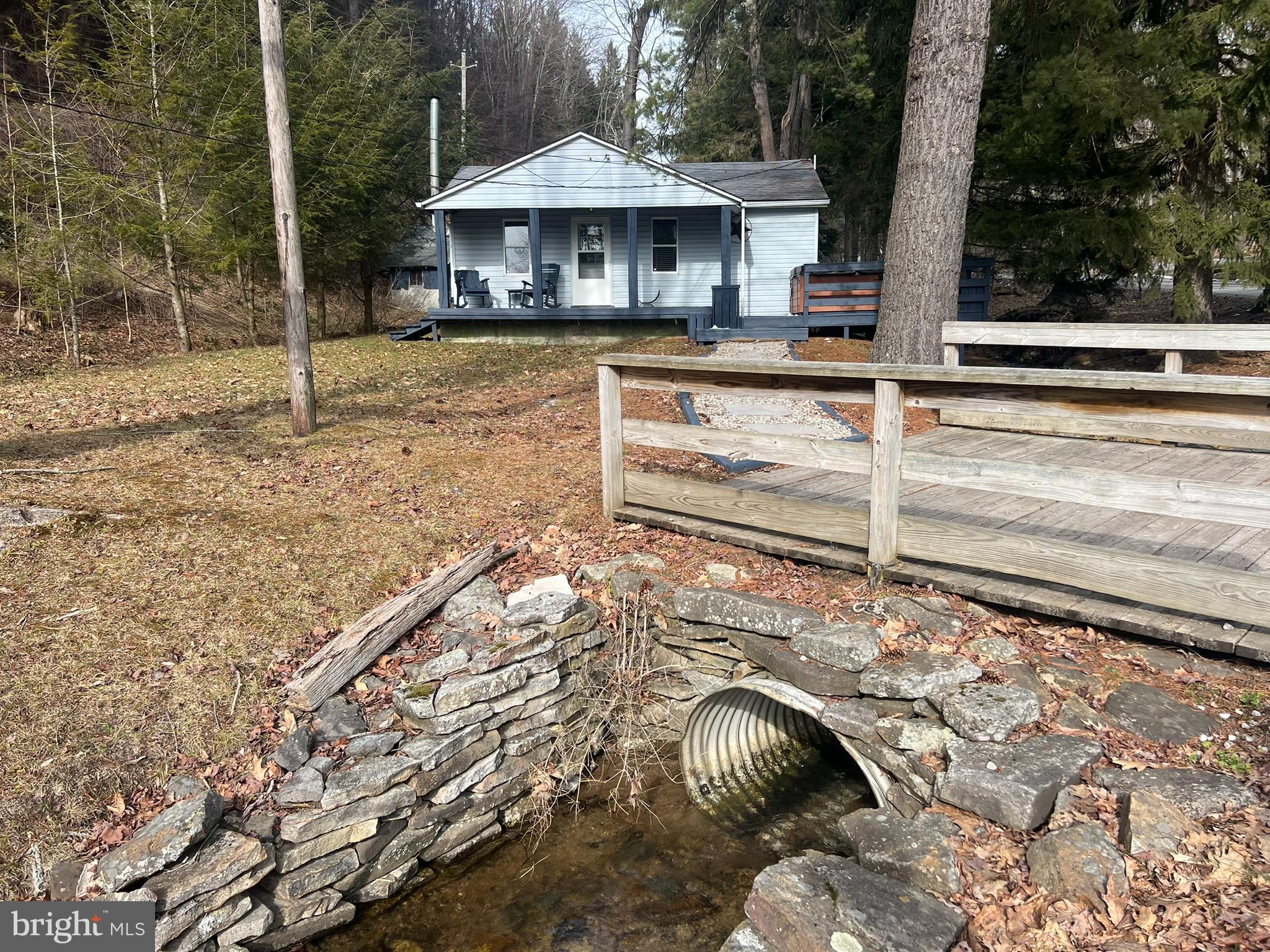 193 Gravelly Run Road McHenry, MD 21541 - Photo 4 of 57 a backyard of a house with table and chairs