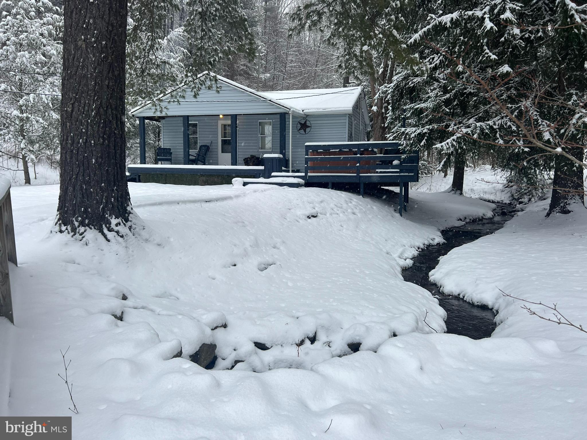 193 Gravelly Run Road McHenry, MD 21541 - Photo 54 of 57 a view of a house with a yard covered in snow