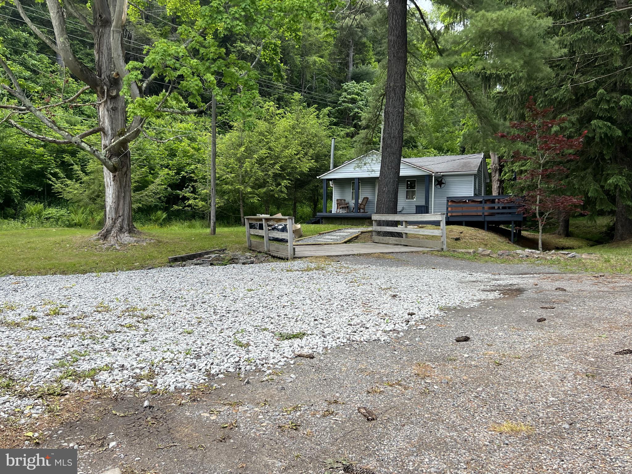 193 Gravelly Run Road McHenry, MD 21541 - Photo 10 of 57 a view of a house with backyard and trees