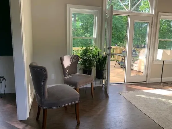 a view of a livingroom with furniture and a window