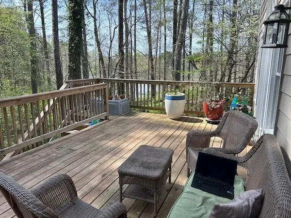 a view of a balcony with two chairs