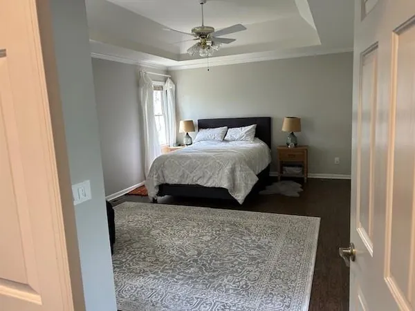 a bedroom with a bed and a table