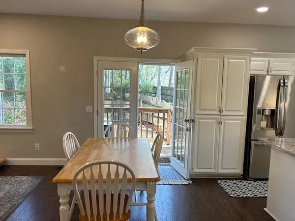 a view of a dining room with furniture window and wooden floor