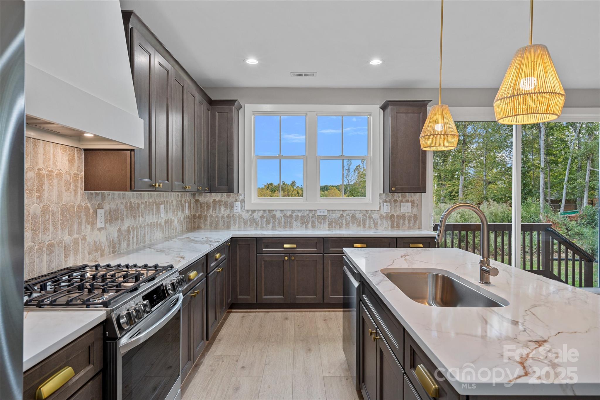 155 Rimrock Road Harmony, NC 28634 - Photo 16 of 39 a kitchen with a sink stove top oven and cabinets