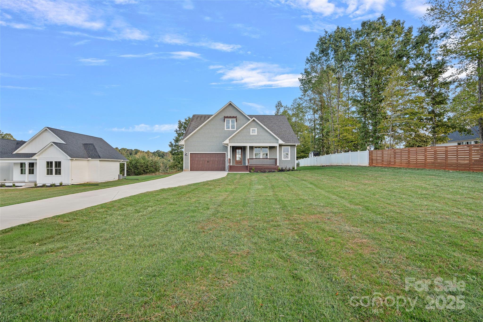155 Rimrock Road Harmony, NC 28634 - Photo 35 of 39 a view of a house with a big yard and large trees