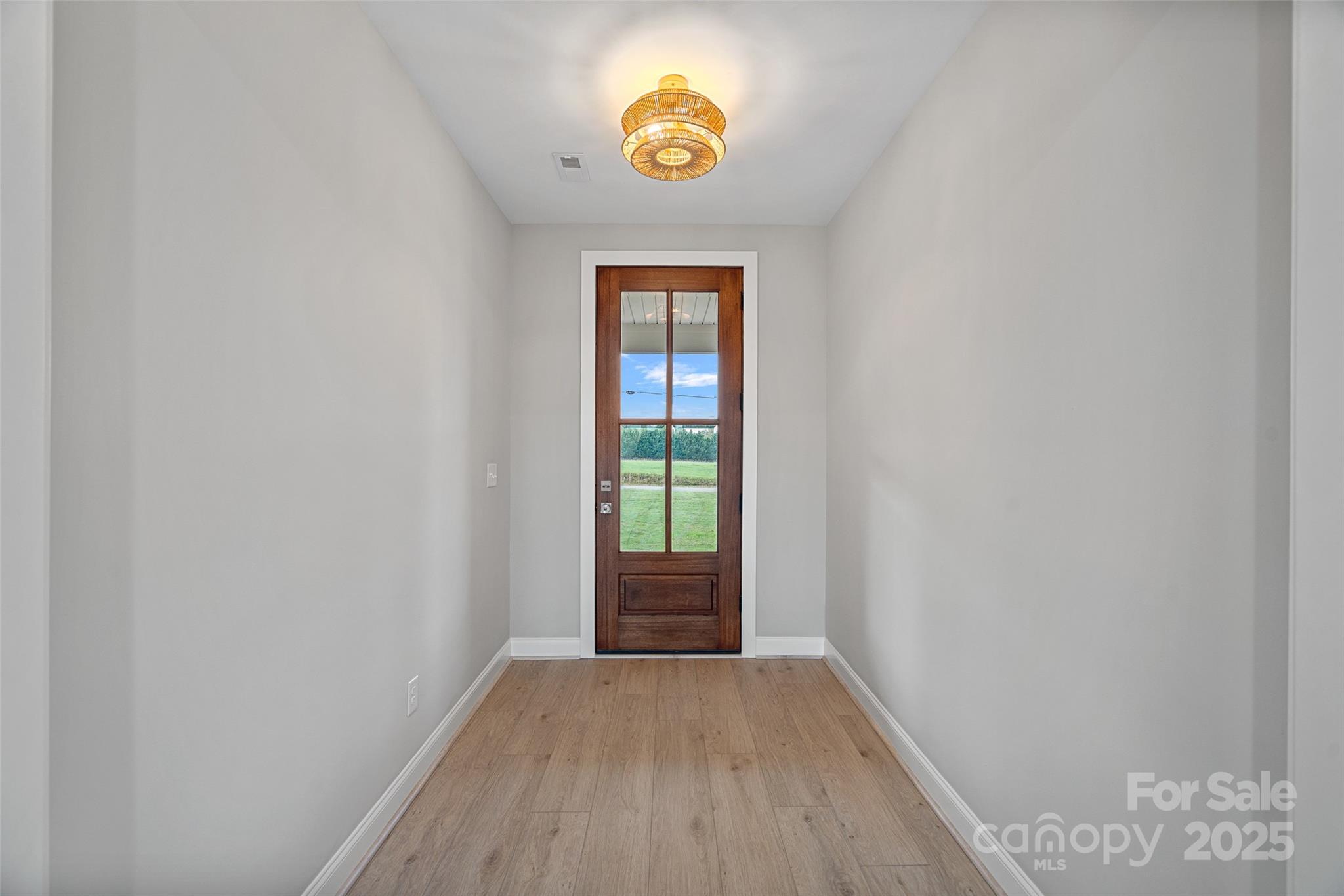 155 Rimrock Road Harmony, NC 28634 - Photo 4 of 39 a view of an entryway with wooden floor