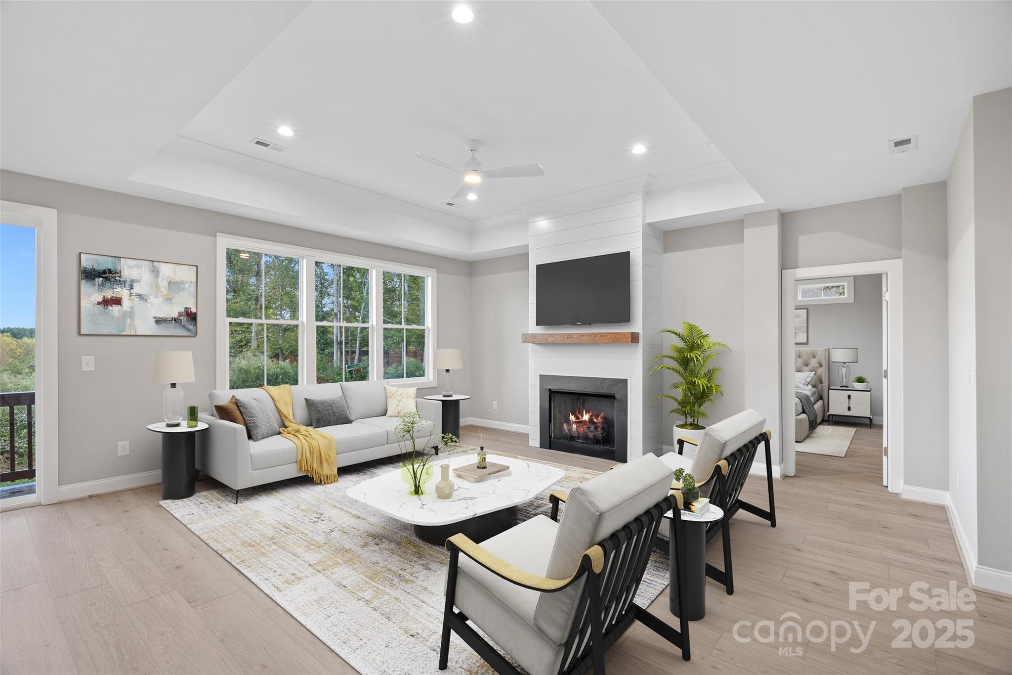 155 Rimrock Road Harmony, NC 28634 - Photo 8 of 39 a living room with furniture a fireplace and a flat screen tv