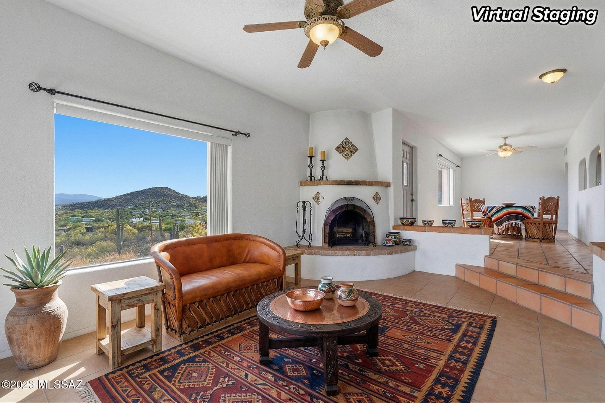3940 West Alvaro Road Tucson, AZ 85746 - Photo 3 of 44 living space with sunk in living room with views and Beehive fire place