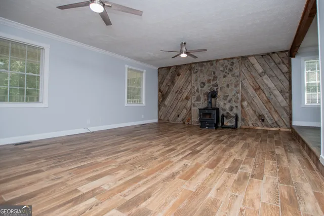 a kitchen with stainless steel appliances granite countertop wooden cabinets a refrigerator and a stove