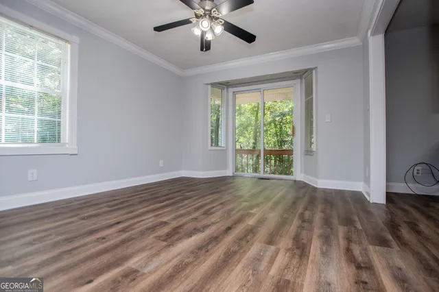 a kitchen with wooden cabinets and a stove top oven