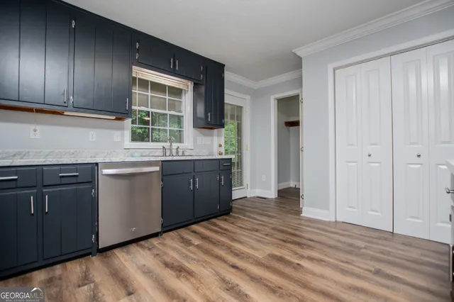 a bathroom with a sink toilet and a mirror