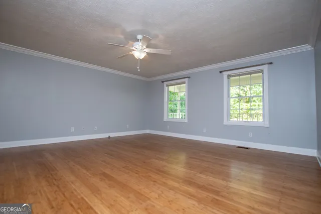 a view of a livingroom with a chandelier fan