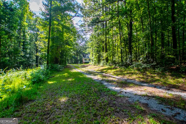 a view of outdoor space with deck and yard