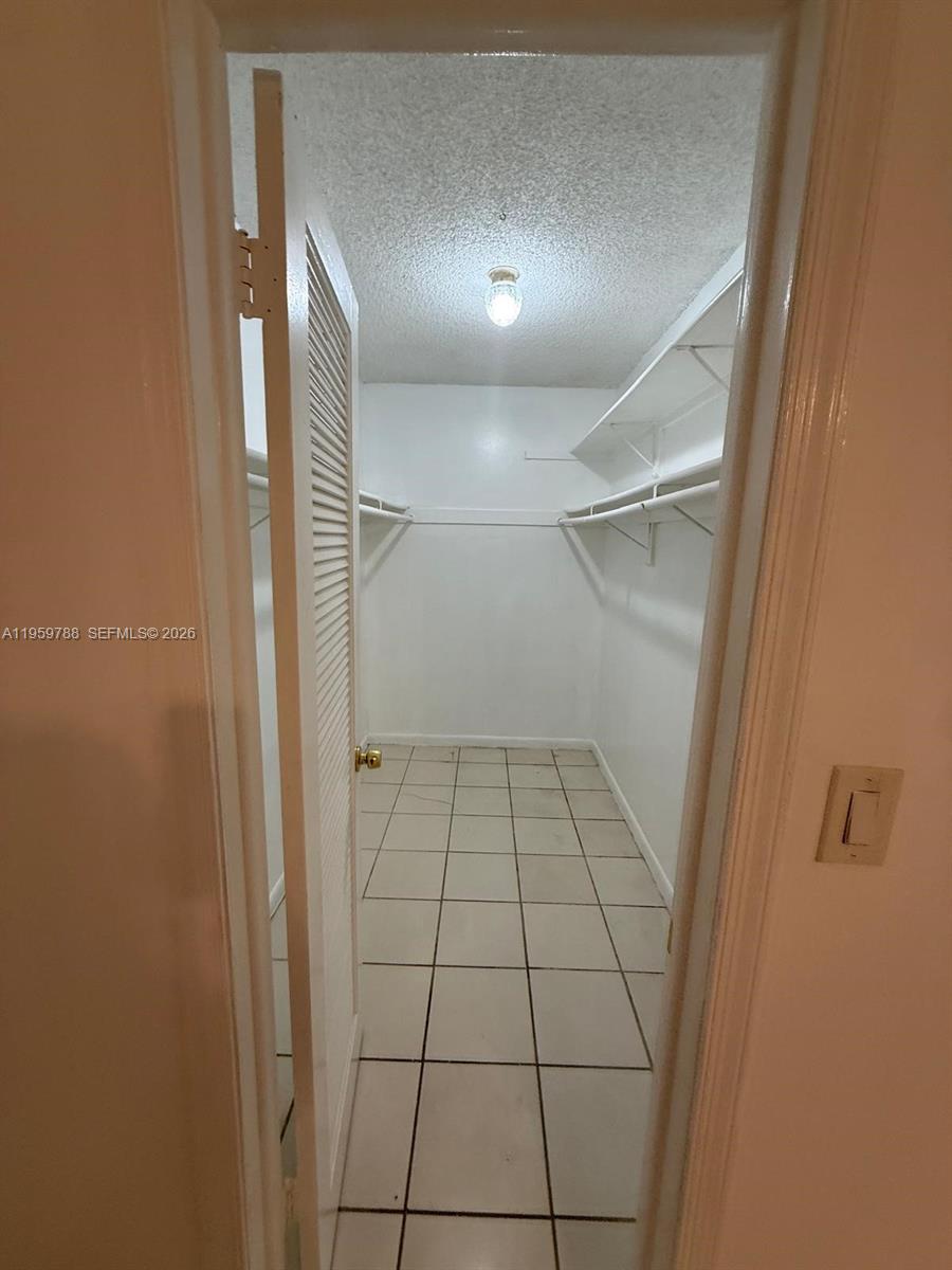 9520 Southwest 8th Street, Unit 111 Miami, FL 33174 - Photo 14 of 31 a bathroom with a vanity and a shower