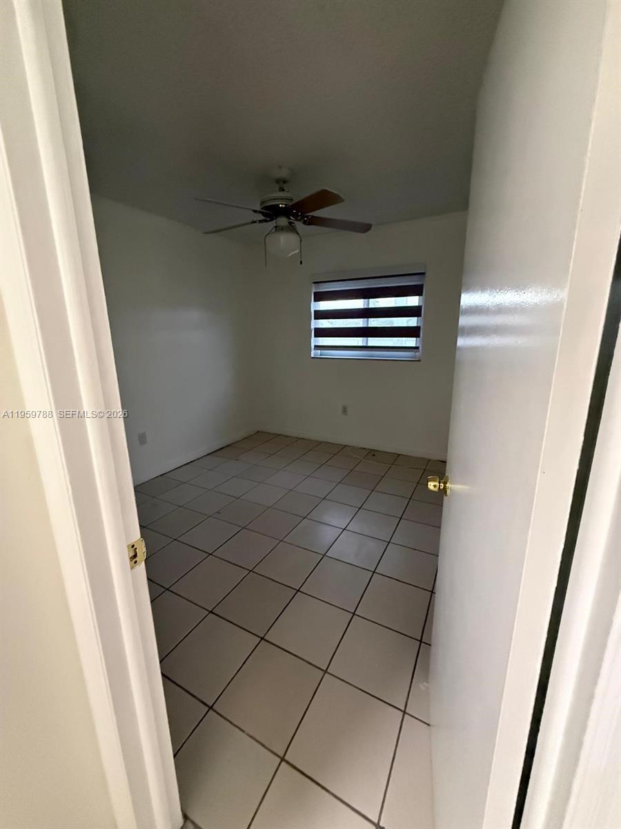 9520 Southwest 8th Street, Unit 111 Miami, FL 33174 - Photo 20 of 31 a view of an empty room and staircase