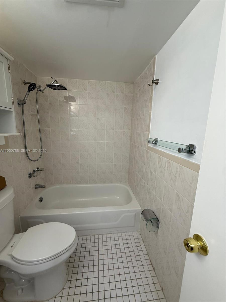 9520 Southwest 8th Street, Unit 111 Miami, FL 33174 - Photo 27 of 31 a bathroom with a toilet and a shower