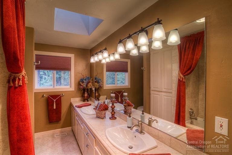 60192 West Ridgeview Drive Bend, OR 97702 - Photo 14 of 25 a bathroom with a double vanity sink and a mirror