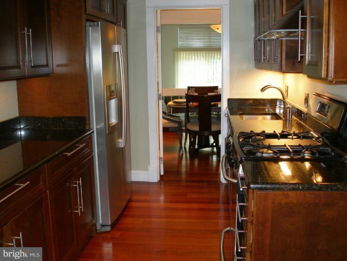1634 Bentana Way Reston, VA 20190 - Photo 15 of 18 Kitchen to Dining Room