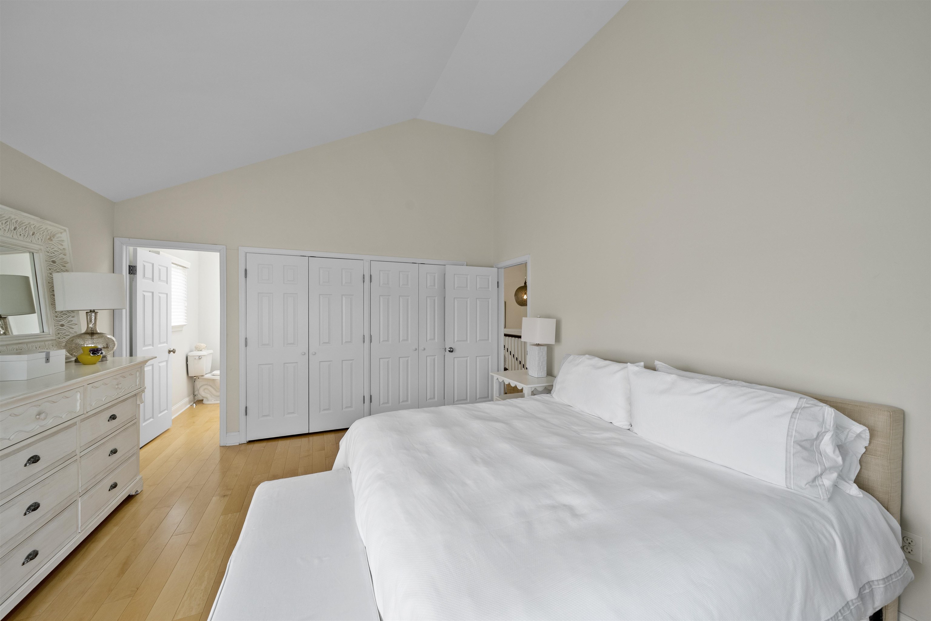 25 9th Street Avalon, NJ 08202 - Photo 12 of 32 a bedroom with a bed and a dresser in it