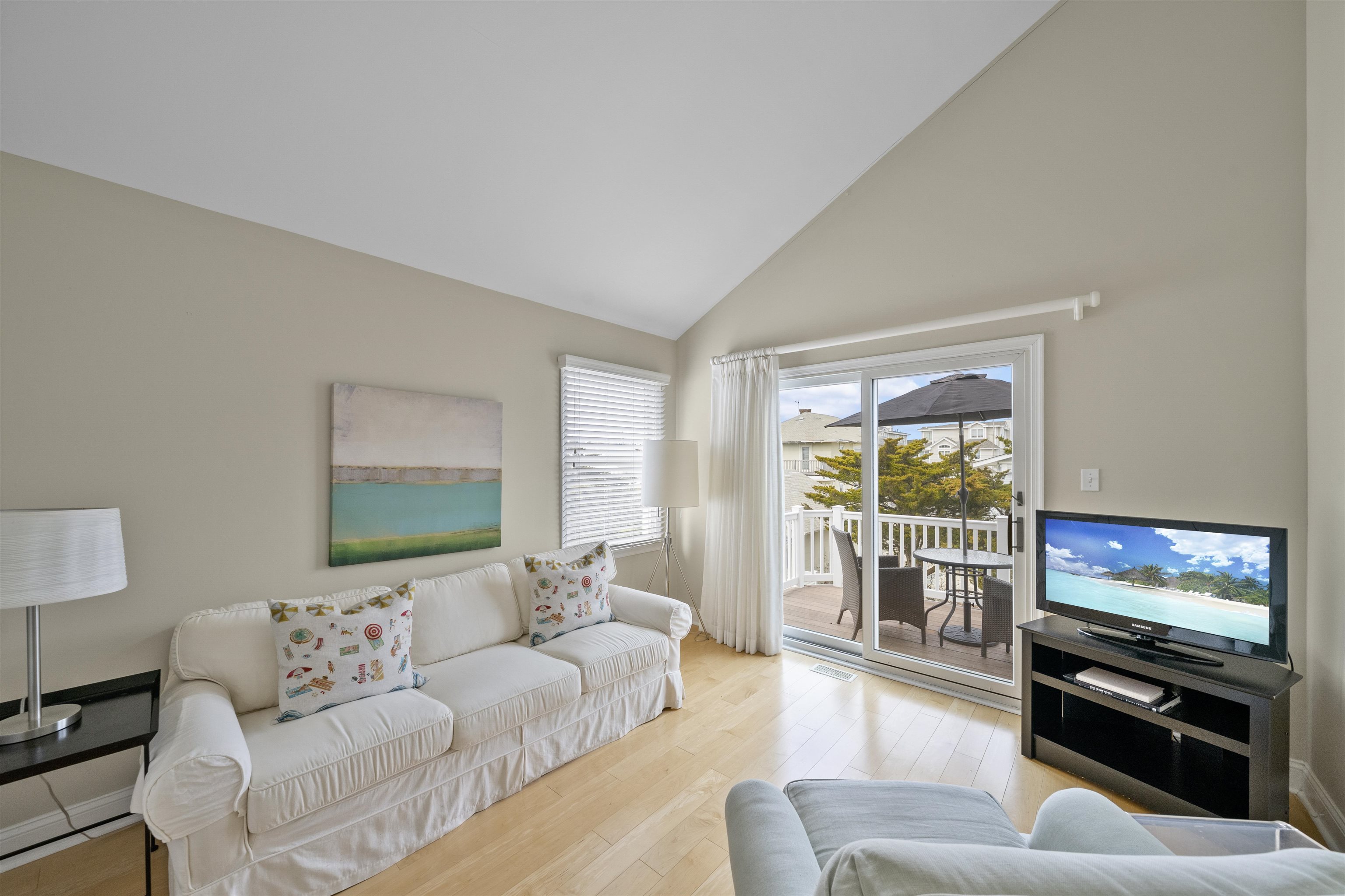 25 9th Street Avalon, NJ 08202 - Photo 14 of 32 a living room with furniture and a flat screen tv