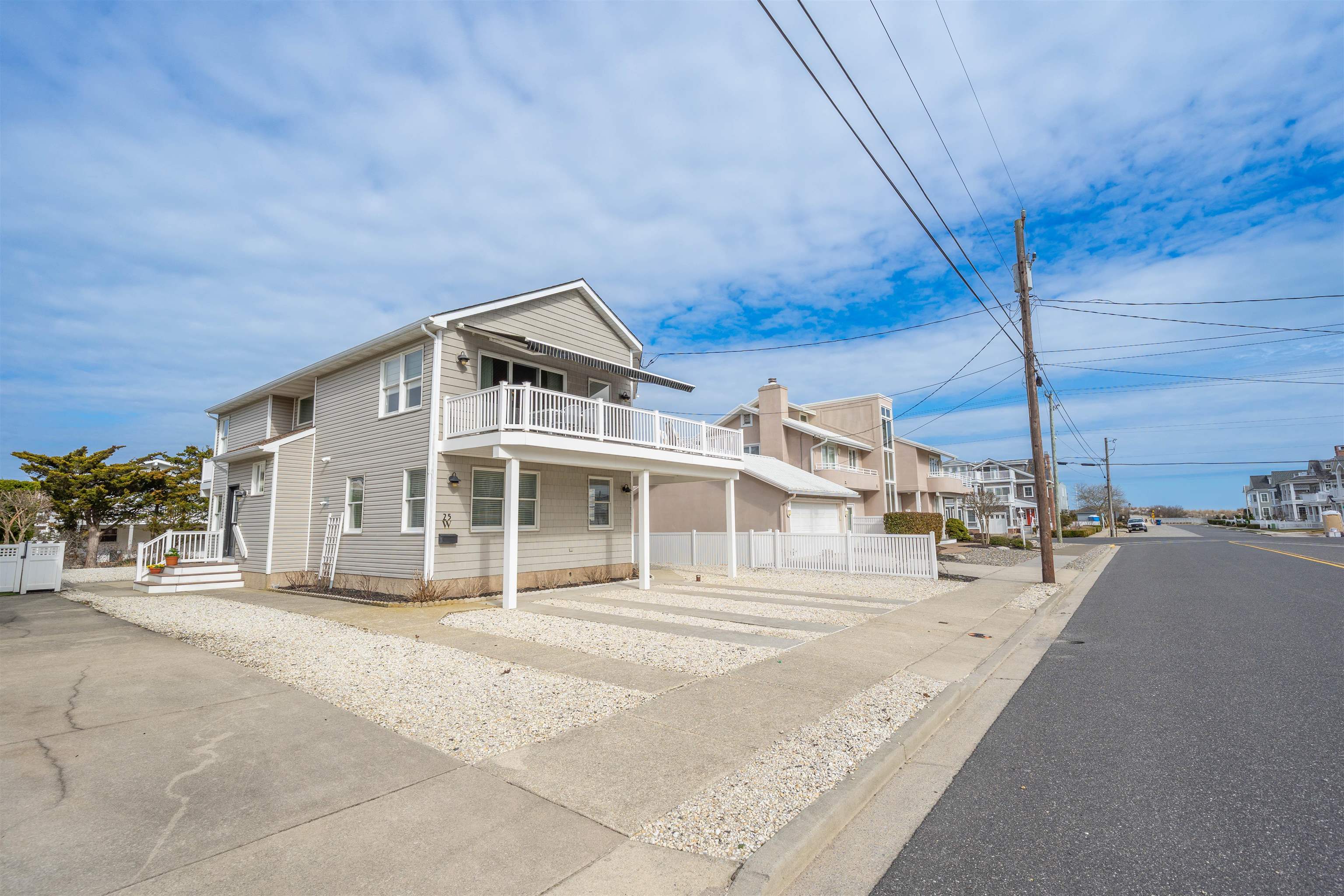 25 9th Street Avalon, NJ 08202 - Photo 21 of 32 a front view of a house with a garden