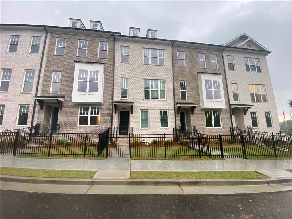 a view of a building with a swimming pool