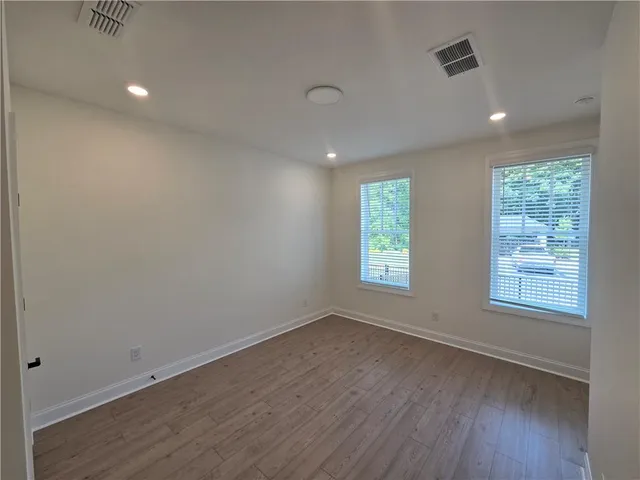 a bathroom with a double vanity sink toilet and shower
