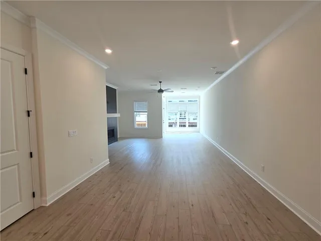 a view of a room with window and wooden floor