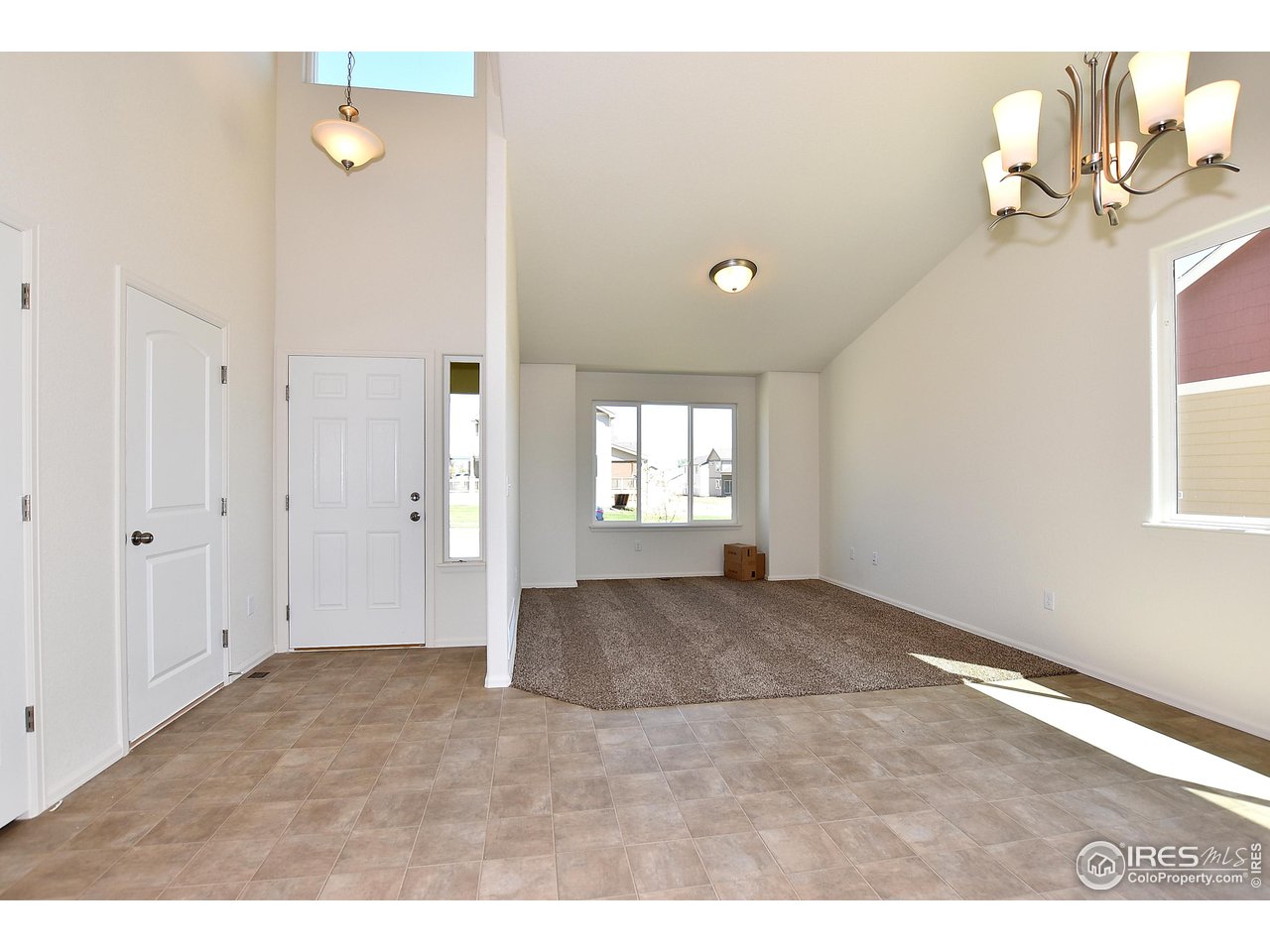 2324 Golden Way Windsor, CO 80550 - Photo 17 of 39 a view of an empty room with a window