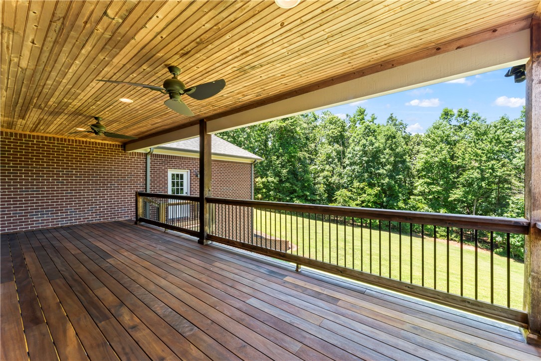 579 Terrapin Crossing Road Pickens, SC 29671 - Photo 46 of 50 An inviting outdoor living area with a rich tigerwood deck and serene treed views.