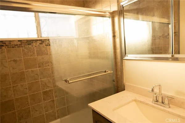 a bathroom with a sink and a shower
