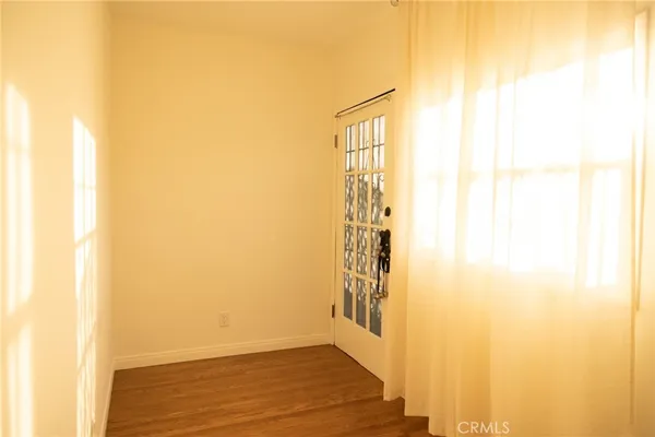 a view of entryway with wooden floor