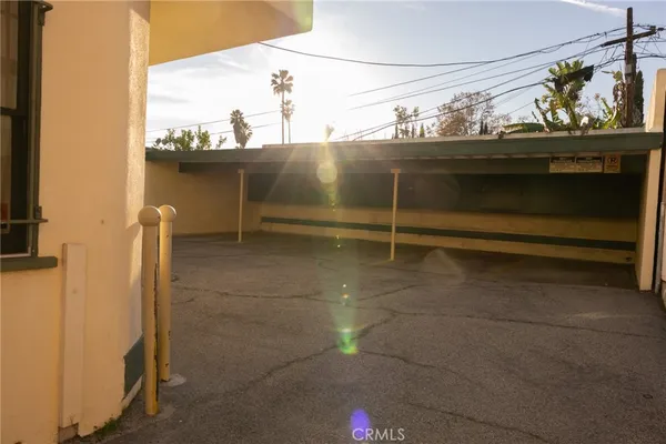 a view of a hallway with wooden floor and entryway