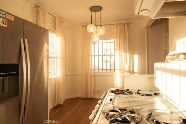 a bedroom with bed and a window