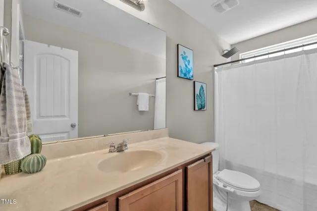 a bedroom with a bed and a book shelf