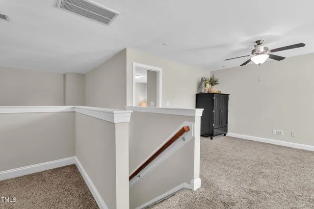 a bathroom with a sink mirror vanity and toilet