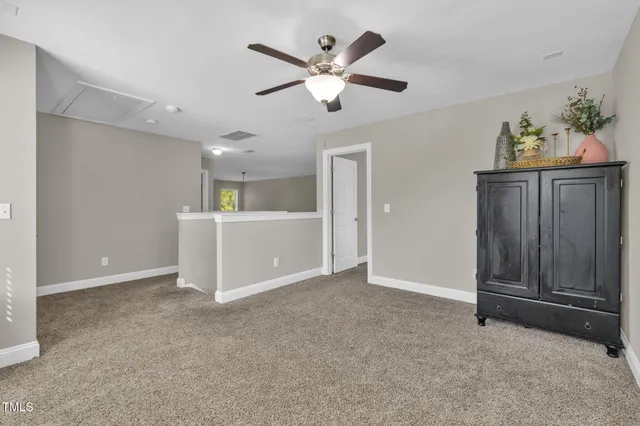 a view of a hallway with a chandelier