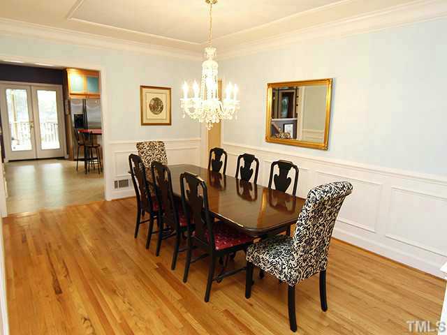 3105 Churchill Road Raleigh, NC 27607 - Photo 11 of 16 a view of a dining room with furniture and wooden floor