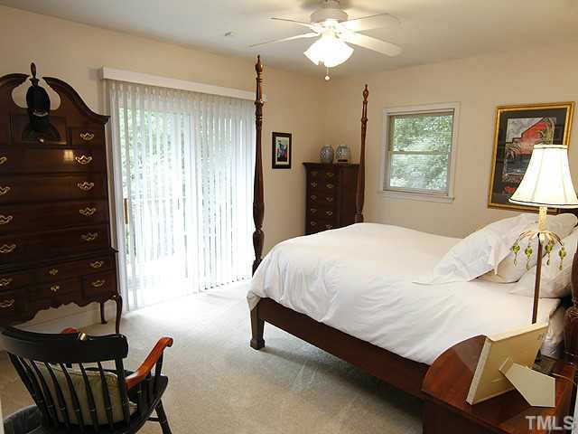 3105 Churchill Road Raleigh, NC 27607 - Photo 12 of 16 a bed sitting in a bedroom next to a window