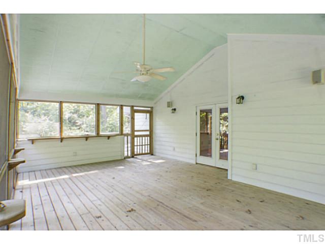 3105 Churchill Road Raleigh, NC 27607 - Photo 16 of 16 a view of an empty room with wooden floor and a window