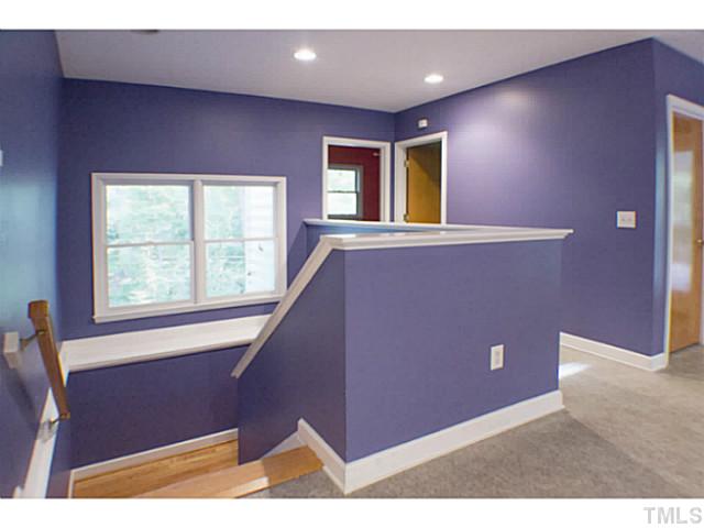 3105 Churchill Road Raleigh, NC 27607 - Photo 7 of 16 a view of an empty room with windows