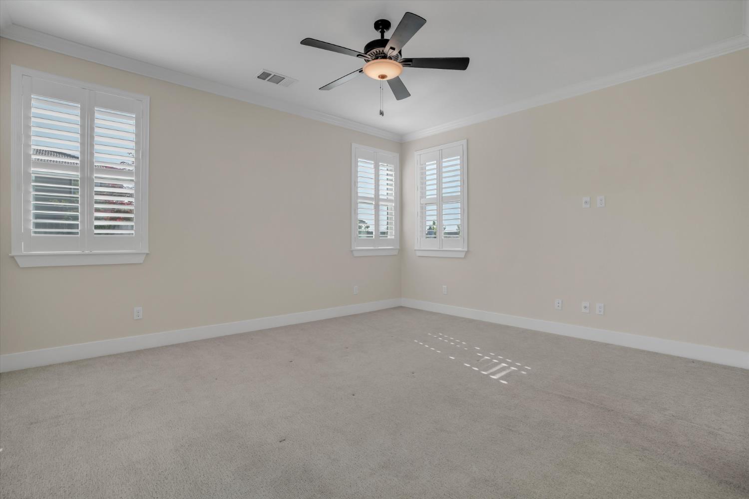1898 Sanza Road Manteca, CA 95337 - Photo 16 of 41 an empty room with a window and a ceiling fan