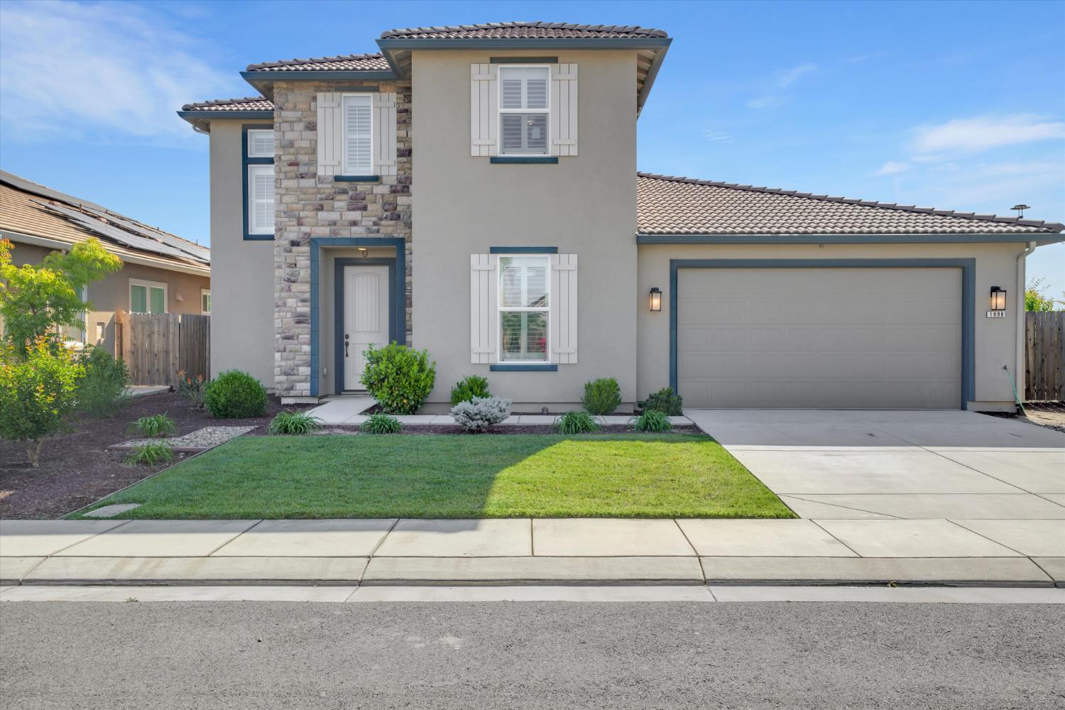1898 Sanza Road Manteca, CA 95337 - Photo 2 of 41 a house with yard and a outdoor space