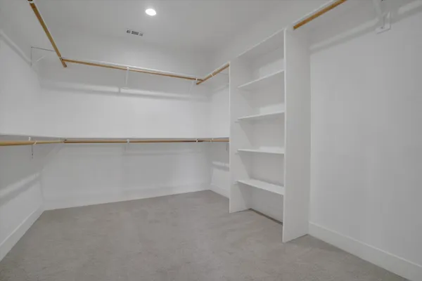 a view of an empty walk in closet