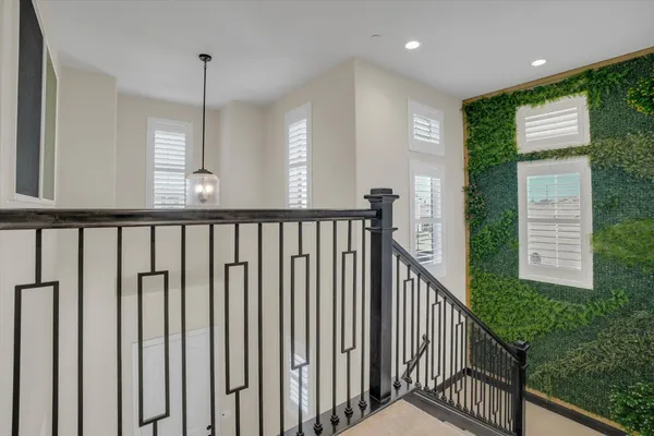 a view of a hallway with stairs