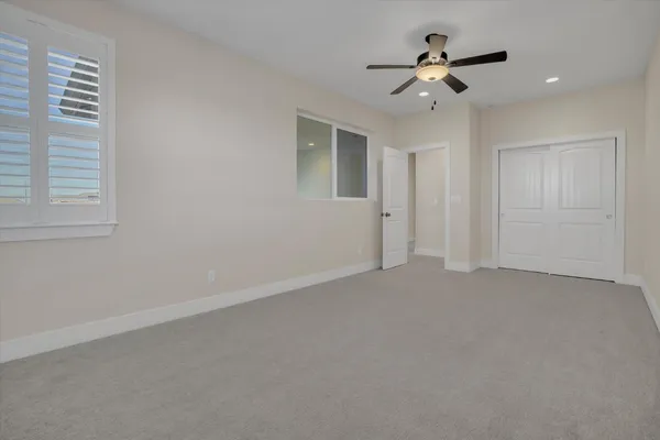 a view of room with ceiling fan