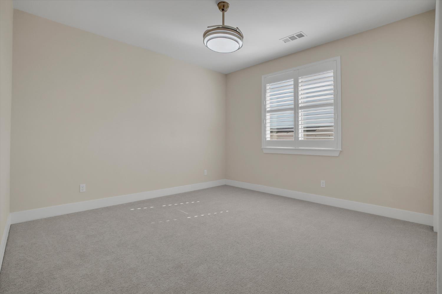 1898 Sanza Road Manteca, CA 95337 - Photo 26 of 41 an empty room with a empty space and windows