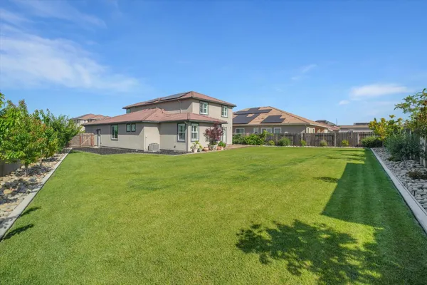 a view of a house with a big yard